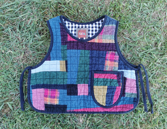 Colorful quilted vest on grass