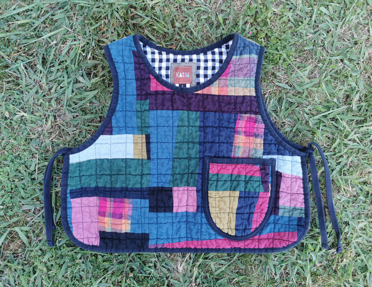 Colorful quilted patchwork vest by KABIN NZ on grass